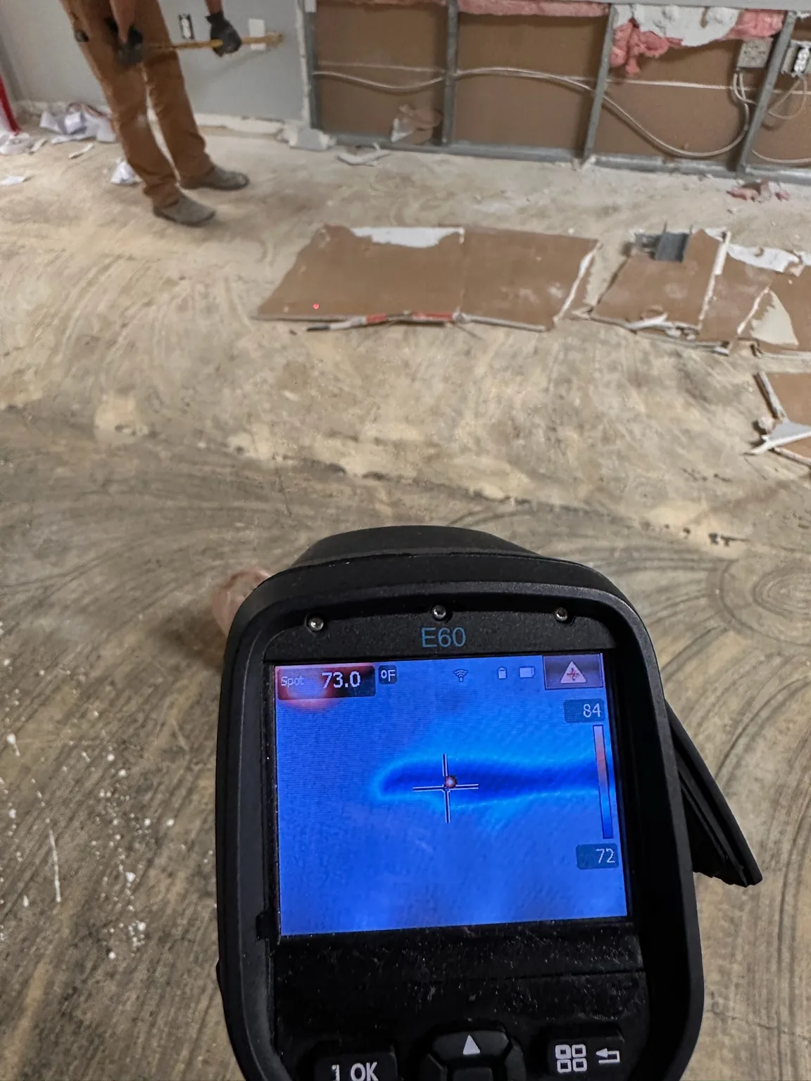 Thermal view paired with an opened commercial metal-stud wall assembly.