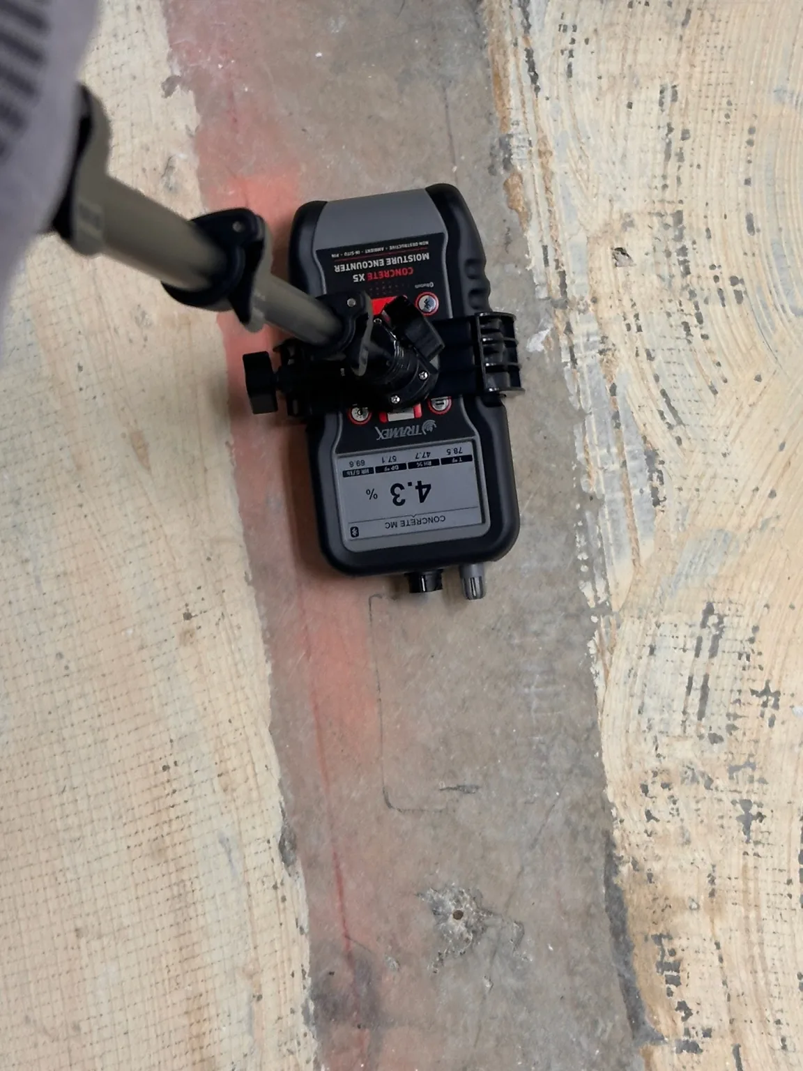 A second concrete moisture-comparison reading at another substrate location.