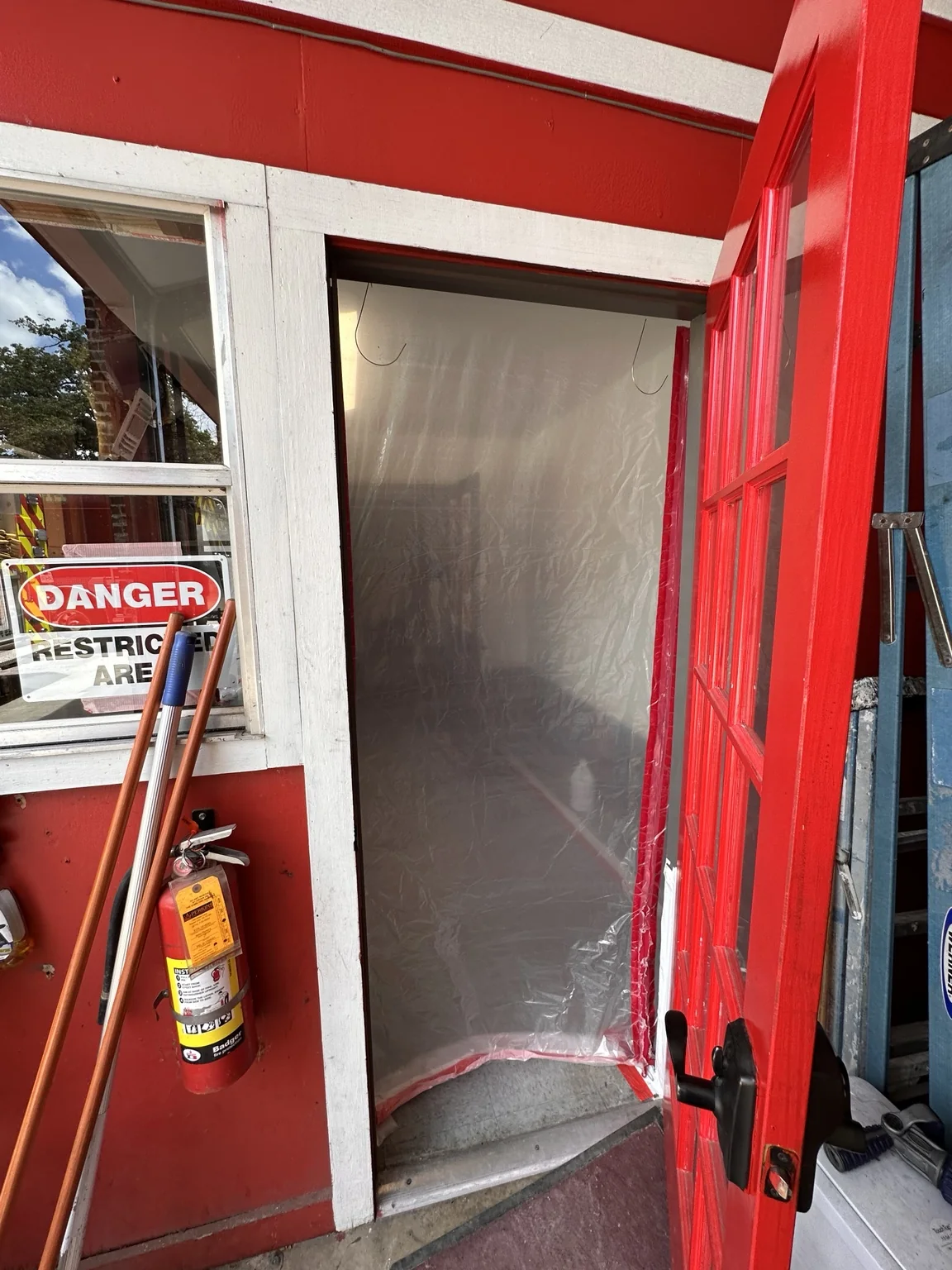 Temporary barrier at a fire station work-area entrance